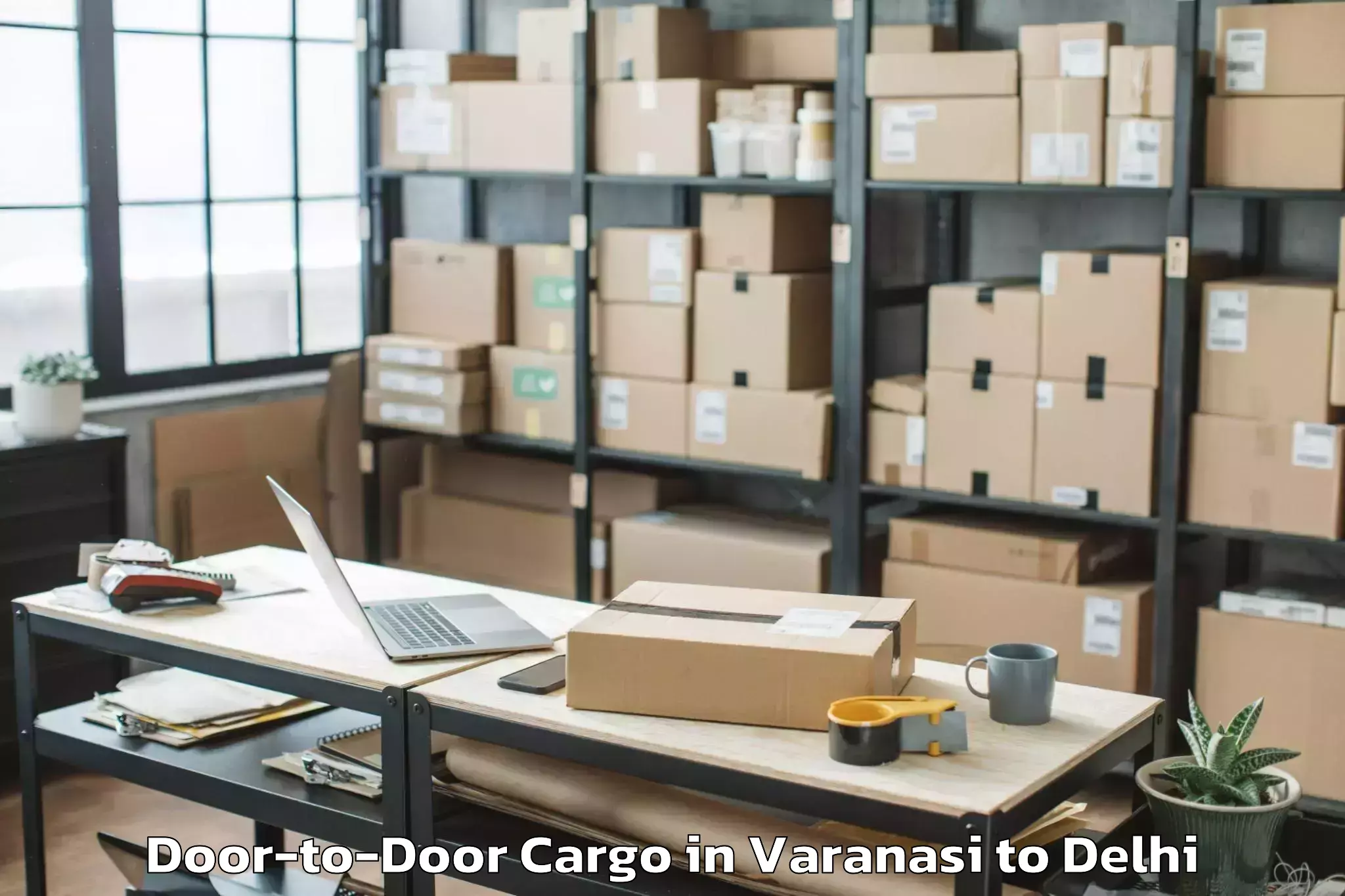 Easy Varanasi to Chanakya Puri Door To Door Cargo Booking